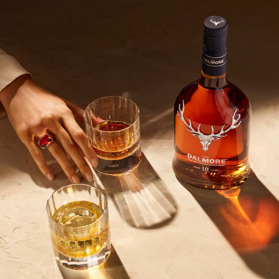 The Dalmore 18 Year old with hand and glasses