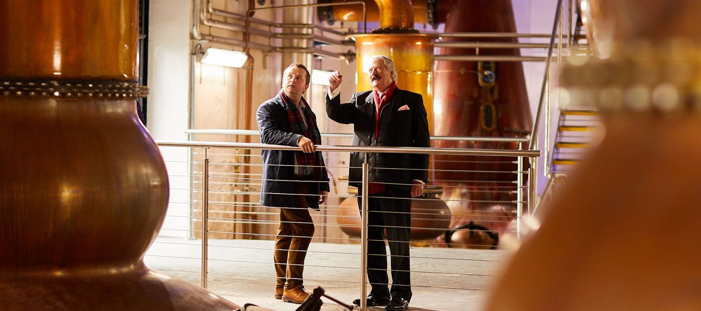 Whisky makers in distillery